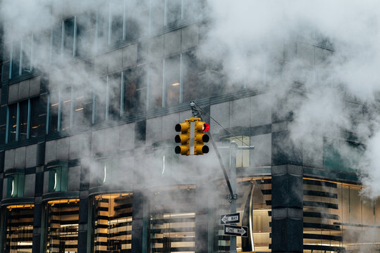 NYC traffic light in street steam