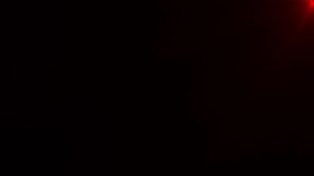 Red light flare emanating from top right corner lens flare