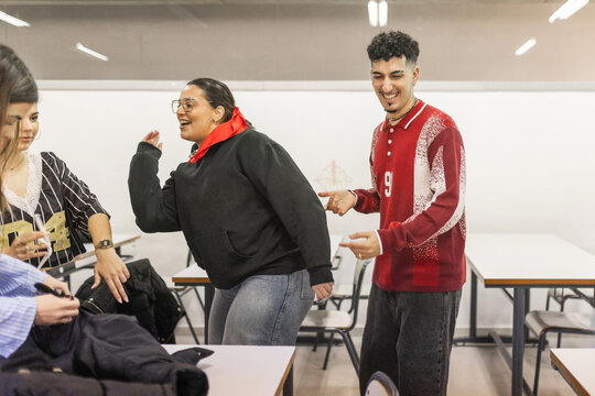 Students dancing together between classes at school
