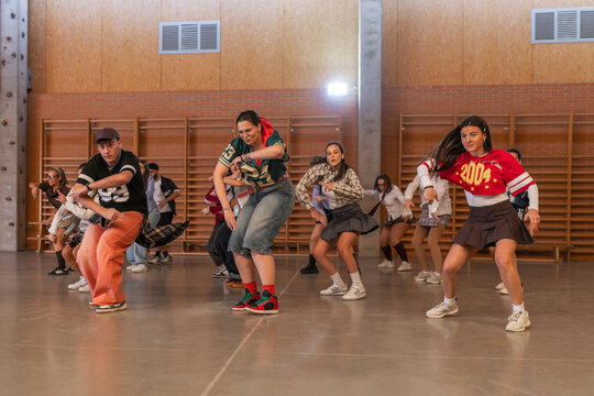 Students performing a group choreography in school gym