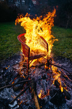 A chair is burned in a bonfire