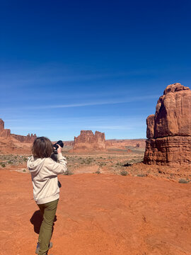 Kid Taking Photo in Arches National Park