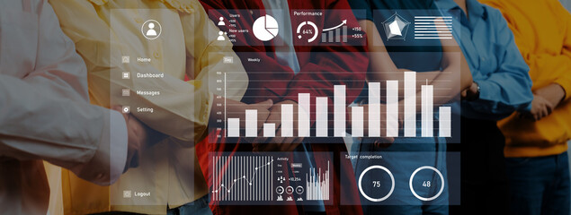 A diverse group of professionals stands together, showcasing teamwork in front of digital...