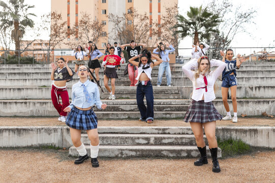 Students dancing across school stands at different levels