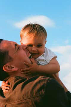 Joyful Father and Child Moment Film Photo