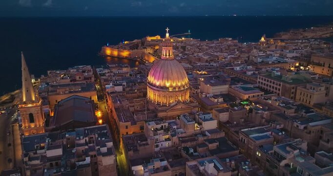 Aerial view of amazing evening night view of church dome in Valletta city. Malta island