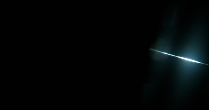 Slow motion cinematic lens flare and light laser leak effect isolated on black background. Perfect overlay for VFX, transitions, title reveals, film burn style and glow highlights.