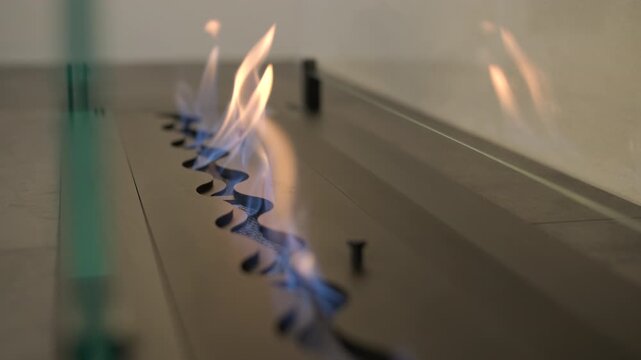 Modern minimalist living room with linear bio fireplace and white boucle armchai
