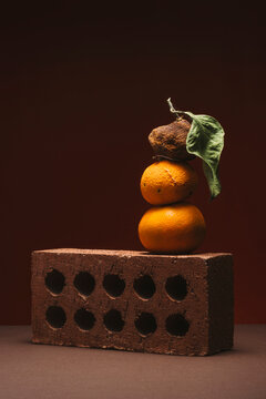 Stack of tangerines on a brick