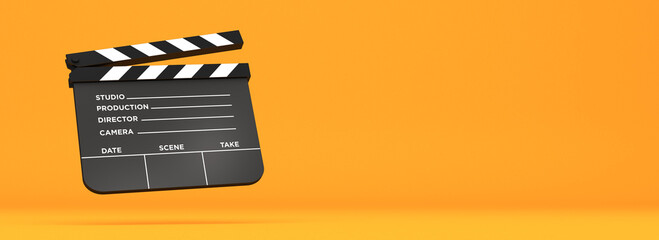 Naklejka premium Realistic 3D rendering of a classic black movie clapperboard isolated on a vibrant orange background. Concept of film production, cinema, and media industry with copy space.