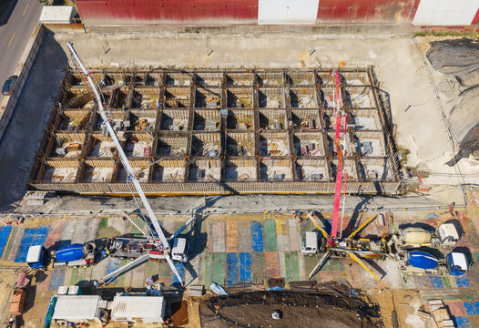 Aerial View of Concrete Pump Trucks at Construction Site