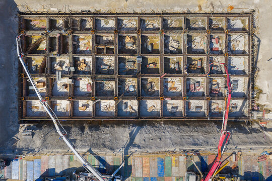 Aerial View of Concrete Pump Trucks at Construction Site