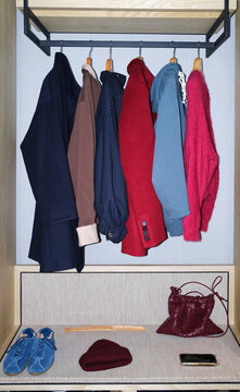 Clothes and accessories arranged in a wardrobe