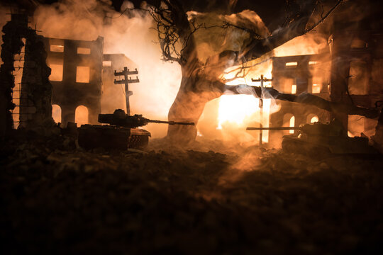 War Concept. Military silhouettes fighting scene on war fog sky background, World War Soldiers Silhouette Below Cloudy Skyline At night. Battle in ruined city.