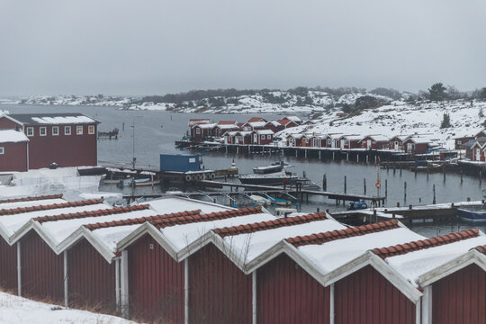 View of Traditional Red swedish Fishing Huts with Snowy Rooftops