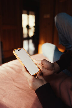 Anonymous woman browsing on smartphone