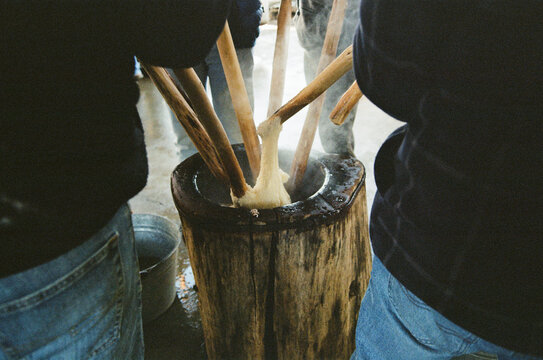Friends and Family Prepare Mochi Rice for A Ceremony Called Mochitsuki