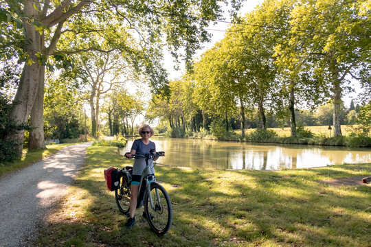 Woman Standing with Touring Bike by the Canal du Midi