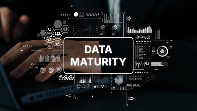 Concept of Data Maturity in Business Analytics with Hands Typing on Keyboard and Graphical Elements. Asymptotic smart data analytic.