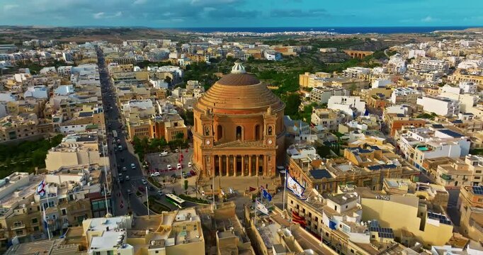 Aerial view of Mosta Church, famous remarkable wartime miracle, architectural landmarks, Malta 