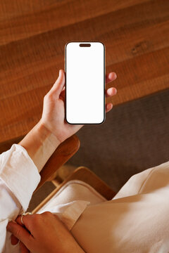 Smartphone mockup with white screen in hand