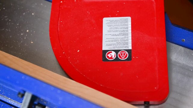 Carpenter operate electric jointer Planer remove excess wood with. Wood shaping, precision cut, workshop tool, material trim, professional skill, surface smoothing