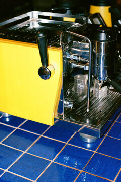 Yellow Espresso Machine On Blue Tile Film Photo