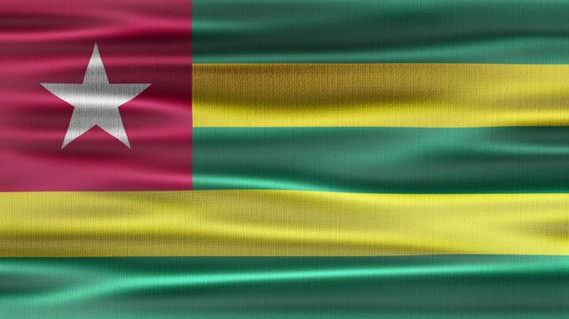 Togo flag waving in the wind with high quality fabric texture