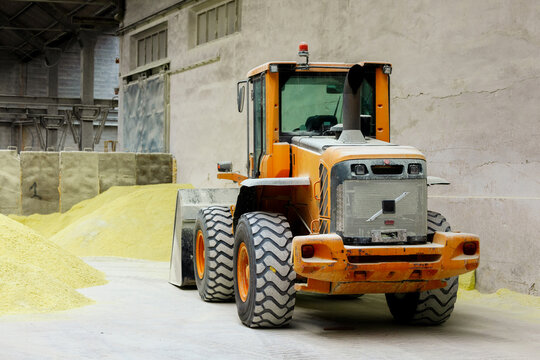 Heavy machinery in industrial warehouse setting