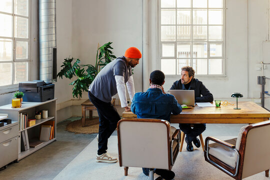 Business team collaborating in creative co-working office