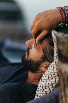 Relaxed Man With Beard Resting Outdoors In Comfort