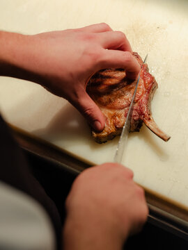 Chef cutting Steak
