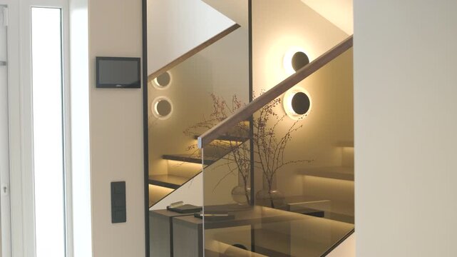 Modern interior design of a wooden staircase with integrated warm LED strip