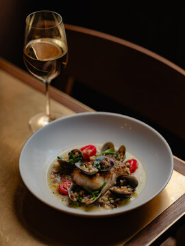 White fish with mussels and cous cous
