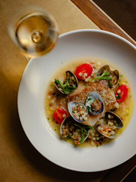 White fish with mussels and cous cous