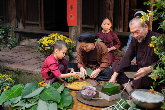 Children Learn Banh Chung Wrapping