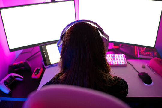 Anonymous gamer at vibrant desk