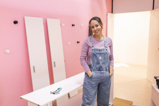 Portrait of entrepreneur standing in her business changing room