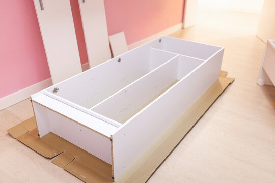 Nearly assembled wardrobe inside small business changing room