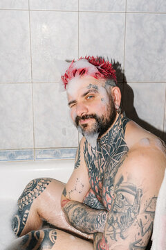 A man relaxes in the bathtub