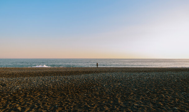A Fishing Moment Before the Vast Sea.