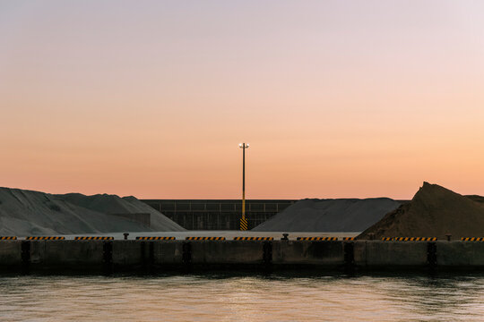 Quiet Dusk at the Seaside Construction Site.