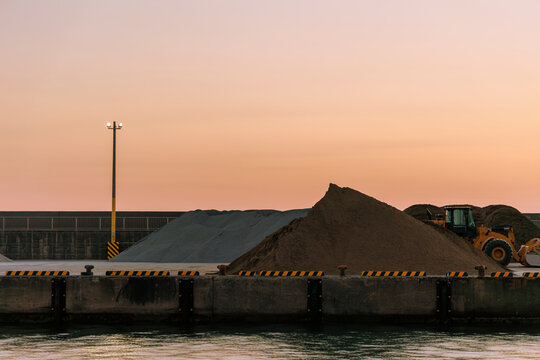Quiet Dusk at the Seaside Construction Site.