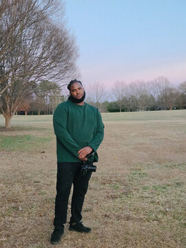 Wide Shot of Filmmaker in Field