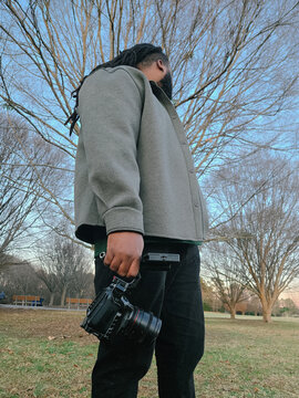 Low Angle of Videographer with Gear