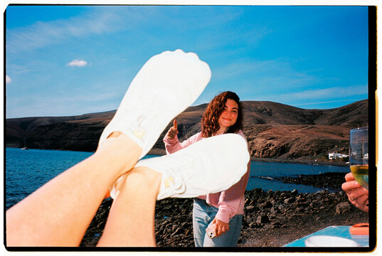Woman thumbs up vacation