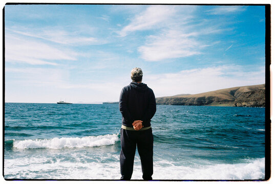 Back view Man Gazing at Sea