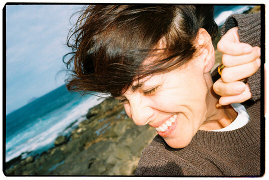 Woman Laughing by Ocean Selfie 