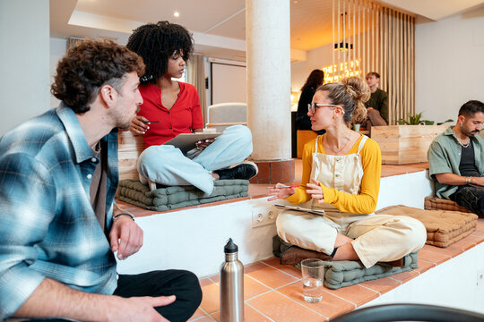 Diverse team collaborating in a modern coworking space