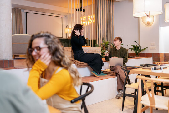 Marketing team collaborating in modern coworking office space